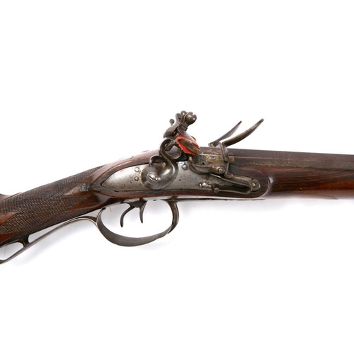 138 - A 19th century  double barrel flintlock shotgun,: the 35 inch two stage barrels with remains of gilt... 