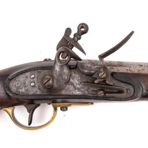 158 - A 19th century flintlock pistol by Tower: the plain 8 1/4 inch barrel over sidelock action signed as... 