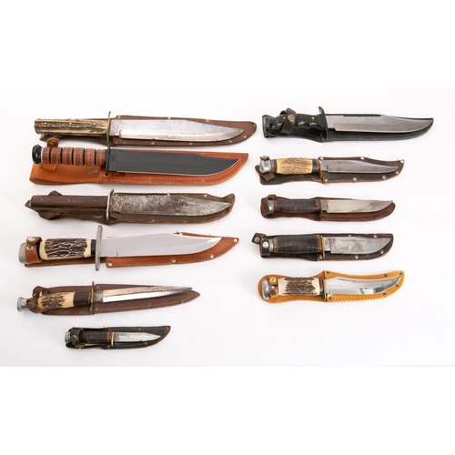 203 - A collection of sheath knives: including a German made Bowie knife with simulated Stag grip and an A... 