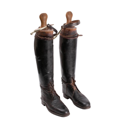 228 - A pair of brown officer boots the type worn by officers in the household cavalry, with wooden trees.... 