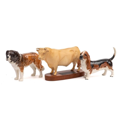 23 - Three Beswick figures: comprising Charolais Bull, under matt, on wooden plinth, Basset Hound 'Foncho... 