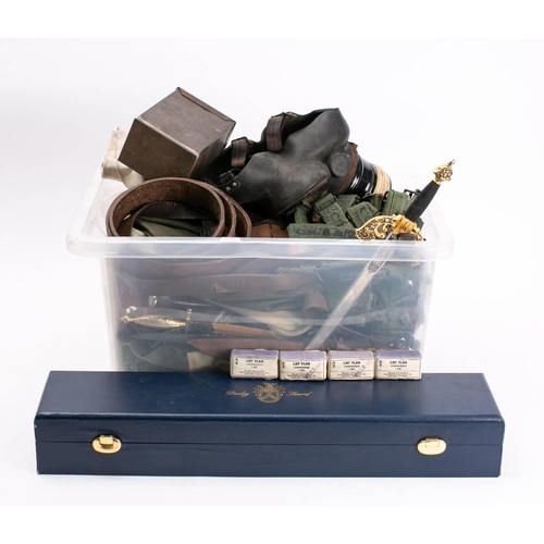 242 - A mixed assortment of militaria: to include browning machine gun ammunition box, webbing, kit bags, ... 