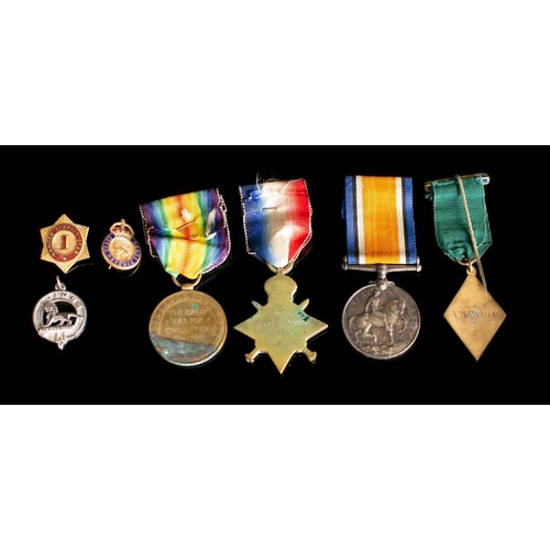 250A - A WWI trio to '94977 Spr., A.M. Bruce R.E': together with four other badges.