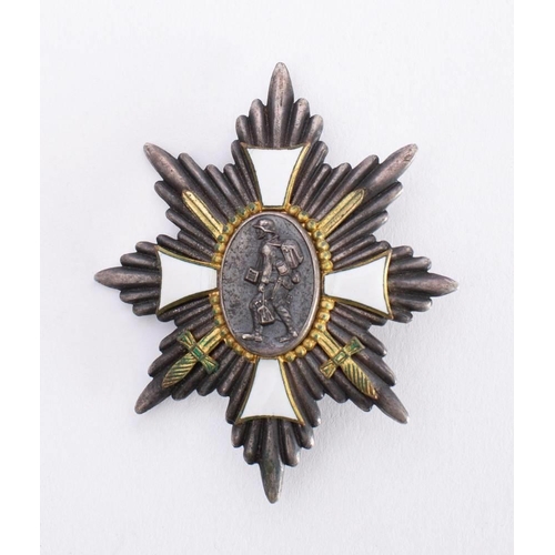 268 - A German Hamburg Cross: the eight pointed star with central oval depicting a German soldier in unifo... 