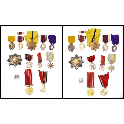 293 - A group of world orders and decorations: including a WWII Imperial Japanese Order of Sacred Treasure... 