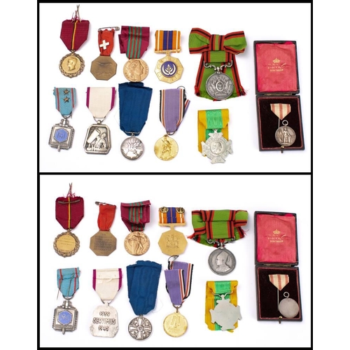 294 - A group of world orders and decorations: including a WWII Belgian Air defence Medal, a Netherlands W... 