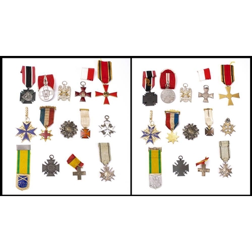 295 - A group of world orders and decorations: including a WWII German Social Welfare medal, a Spanish Civ... 