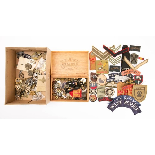 358 - A collection of British and Commonwealth Regimental badges and buttons: including a 1st South Africa... 