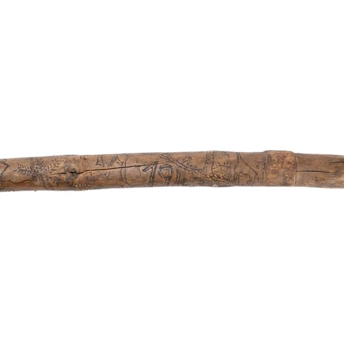 369 - A WWII German Afrikra Korps POW walking cane: the natural root shaft hand decorated with eagle and s... 