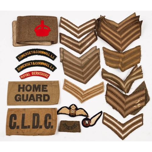 387 - A Home Guard armband,: a Derby Volunteers armband, RAF wings, navigator wings and assorted uniform s... 