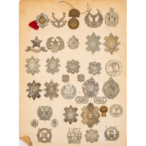 394 - A collection of Scottish Regiment cap badges.: