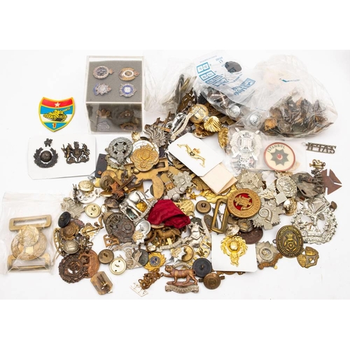 407 - A quantity of assorted badges, belt buckles, buttons and assorted insignia.: