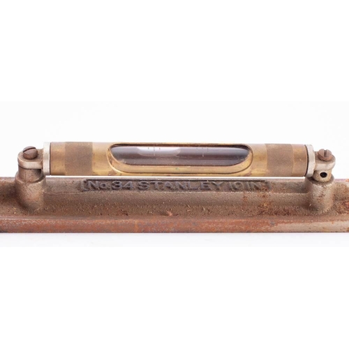 467 - A Stanley No.32  10 inch brass level: with cased spirit bubble, together with Stanley mahogany and b... 