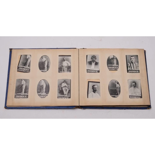 728 - An early 20th century Ogden's Photo Cigarette card album: with part sets of Odgens cricketers, pugil... 