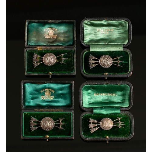 38 - Four Victorian white metal Archery trophy brooches: each in the form of a monogrammed target crossed... 