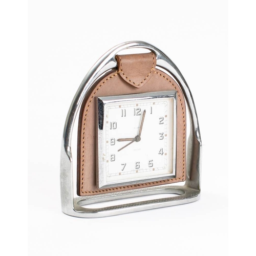 42 - A Smith Stirrup timepiece: the square eight day movement with Arabic numerals in leather suspension ... 