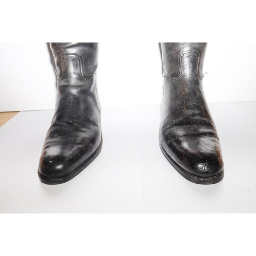 44 - A pair of Tom Hill black leather riding boots with trees: and one other pair of black leather riding... 