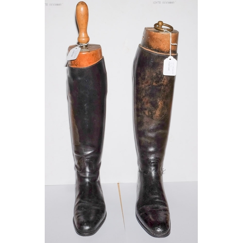 44 - A pair of Tom Hill black leather riding boots with trees: and one other pair of black leather riding... 