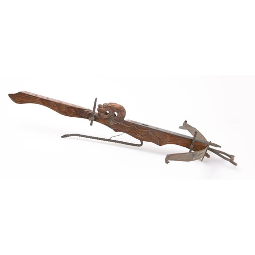 186 - A reproduction wooden crossbow in the Chinese taste:, 97cm long.