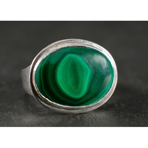 62 - John Sinclair Perkins, a silver malachite ring,: with hallmarks for London, 1996, ring size P 1/2, t... 