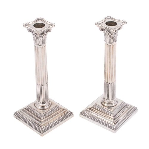 10 - A pair of Edward VII silver candlesticks, maker Goldsmiths & Silversmiths Co Ltd, London, 1903: with... 