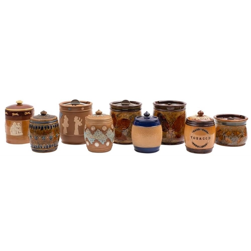 1085 - Nine Doulton stoneware tobacco jars: comprising three Natural Foliage Ware examples, two Silicone, o... 