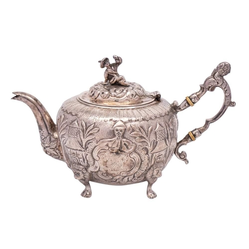 132 - A chinoiserie design silver teapot, unmarked: bears crest and armorial, of circular outline, the dom... 