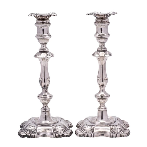 22 - A pair of George V silver candlesticks, maker William Hutton & Sons Ltd, Sheffield, 1923: with urn-s... 