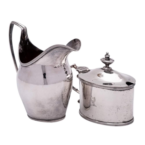 32 - A George III silver mustard pot and cover, maker  John Schofield, London, no date letter: crested, o... 