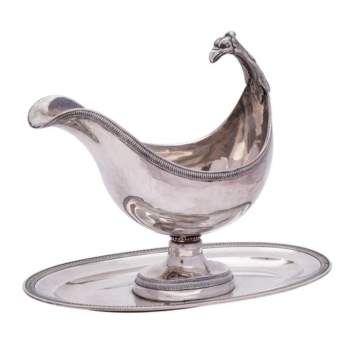 329 - A 19th Century French silver pedestal sauce boat, worn stamped marks: of boat-shaped outline, with e... 