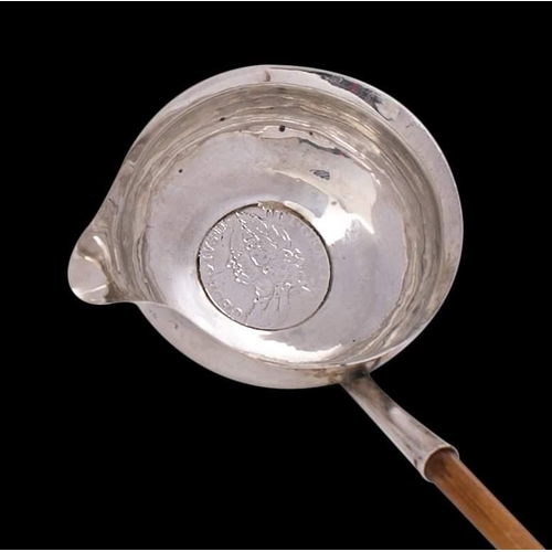 39 - A George III Silver toddy ladle, maker's mark worn, London, 1786: of traditional design with inset c... 