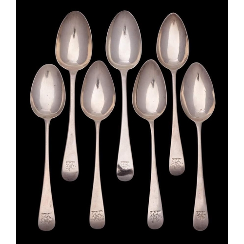 53 - A collection of seven silver Old English pattern dessert spoons, various makers and dates: 227gms, 7... 