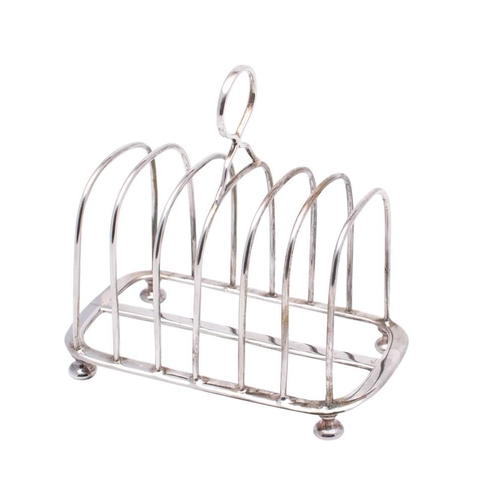 87 - A Victorian silver six division toast rack, maker Holland, Son & Slater, London, 1880: of arched out... 