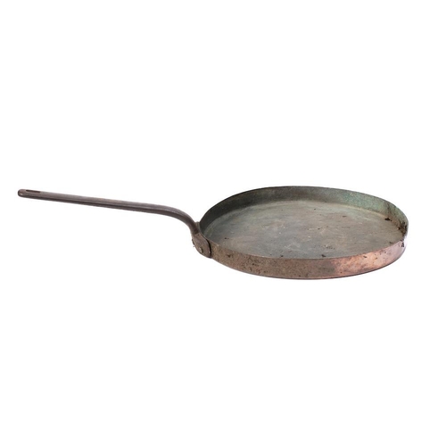 114 - A large circular copper frying pan: with iron handle, 41cm diameter.