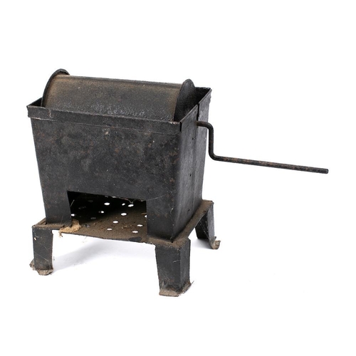 117 - A tin coffee roaster: with 22cm hand operated barrel, in a metal container with draining holes.