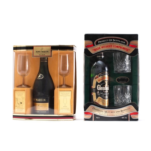 1409 - A bottle of Remy Martin Cognac VSOP in presentation glass pack, together with a similar bottle of Gl... 