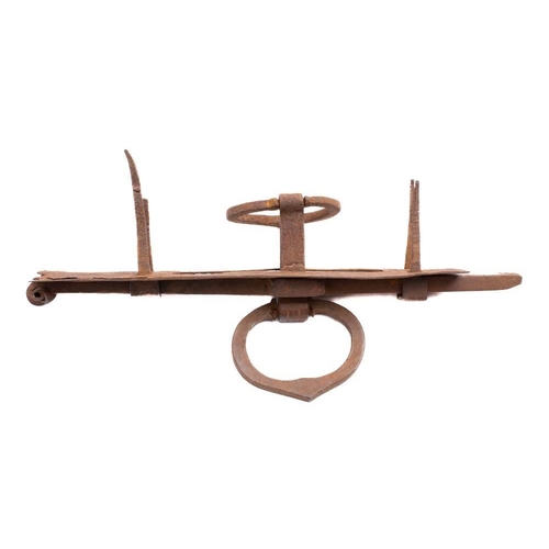 227 - A wrought iron door bolt, 18th century or later: the square section bolt with  ring handles and stip... 