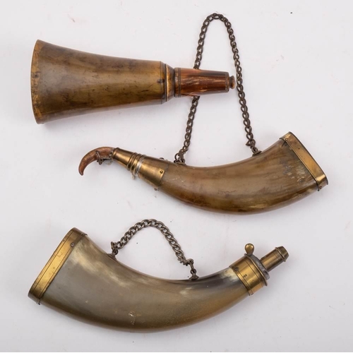 411 - Two brass mounted horn powder flasks:, both unsigned, together with one other horn powder flask (3)