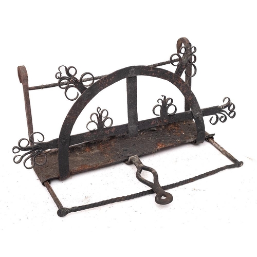 74 - A wrought iron adjustable bar-grate toaster: with fat catcher, having scroll decoration, 49cm wide, ... 