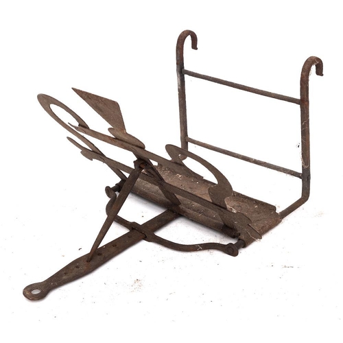 75 - A Scottish iron bar-grate toaster: with thistle motif centre and shaped handle, 37cm wide.