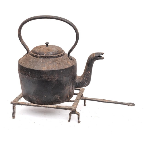 87 - A large Victorian iron kettle:, 27cm diameter and an 18th Century grid iron with shaped handle with ... 