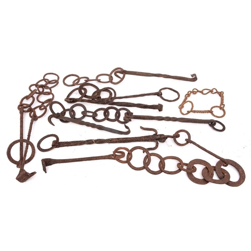 94 - A collection of six iron pot hooks: with ring chains.