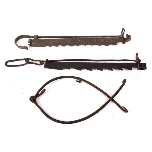 96 - Two wrought iron adjustable pot hooks: of serrated design, together with an iron scissor type pot ho... 