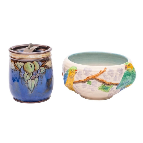 173 - A Clarice Cliff bowl and a Royal Doulton tobacco jar, the former embossed in the Budgerigar pattern ... 