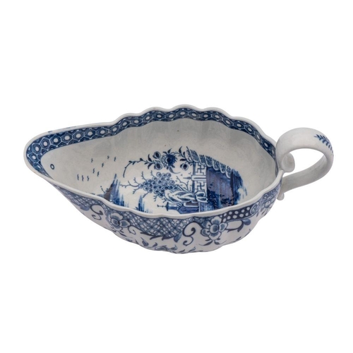 229 - A First Period Worcester blue and white sauceboat of oval fluted form, painted in the 'Full Moon' pa... 