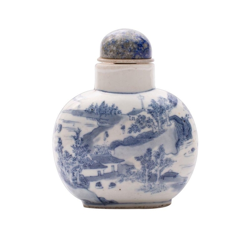 33 - A Chinese blue and white snuff bottle of large size, painted with a dignitary and attendants on a te... 