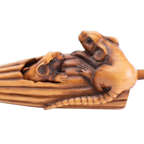 446 - A Japanese boxwood netsuke of two rats, one emerging from an umbrella, unsigned, 9cm long. Meiji per... 