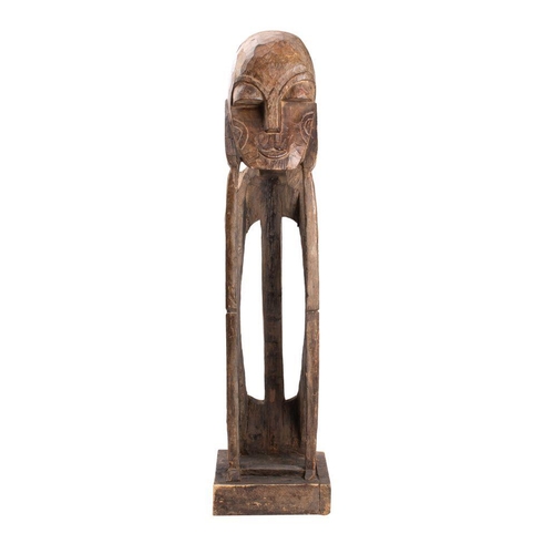 479 - A large African carved softwood figure of a man seated with his head in his hands, 106cm high.