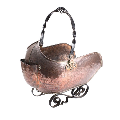 510 - A beaten copper and wrought iron coal scuttle of barge-shaped outline, with spiral twist iron loop c... 