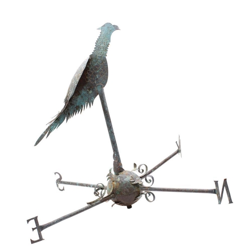 512 - A copper weather vane, in the form of a pheasant mounted on a sphere base with cardinal points, 75cm... 